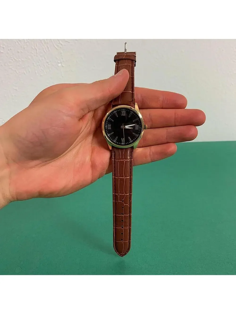 Minimalistic Black essential vintage style gold and leather style band watch. 9